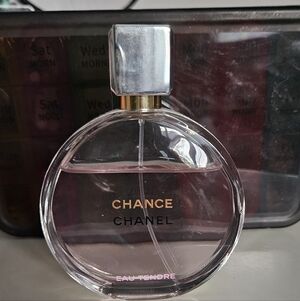 CHANEL Fragrance Bottle with Silver and Pink Accents
